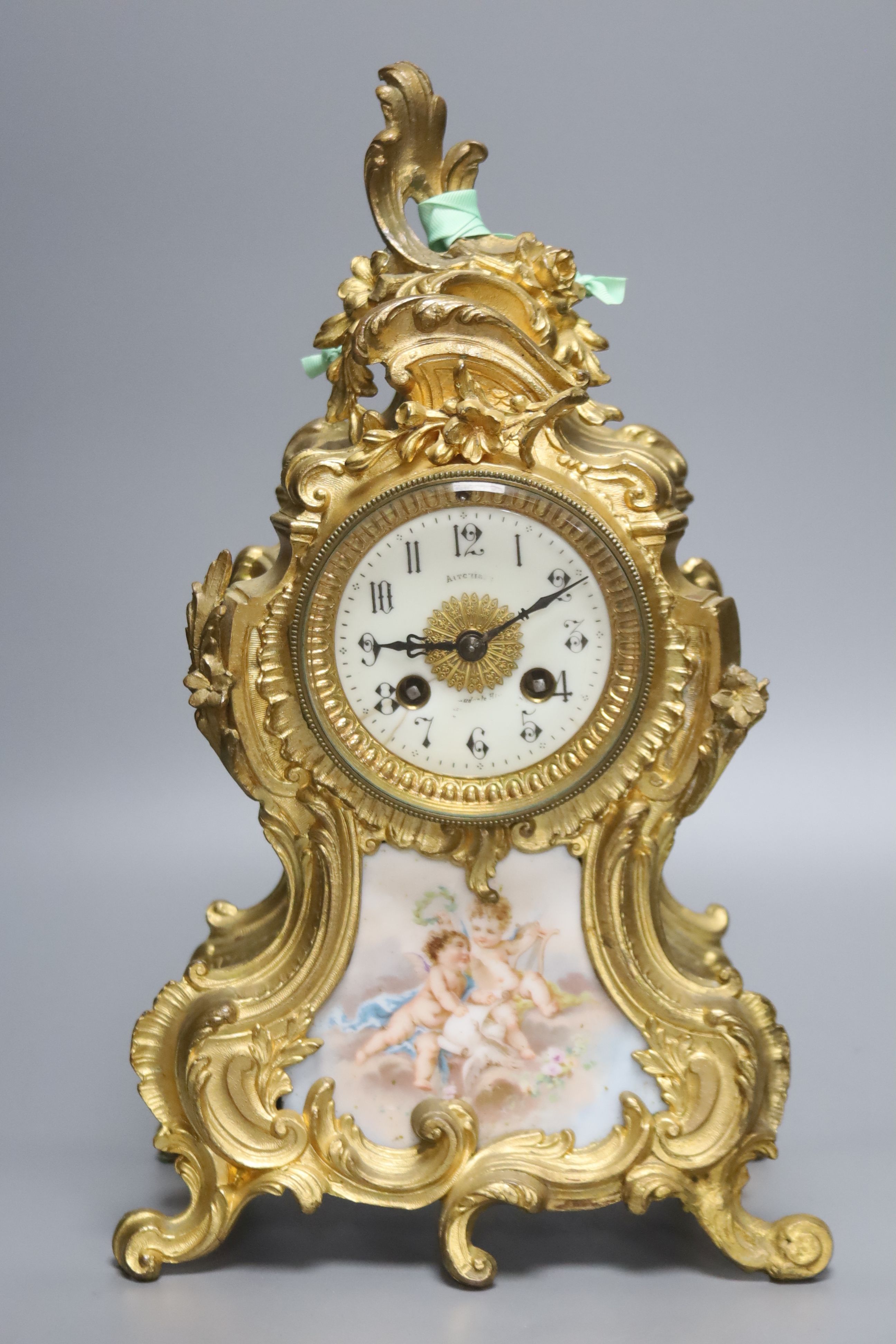 An early 20th century French gilt metal and porcelain eight day mantel clock, height 37cm